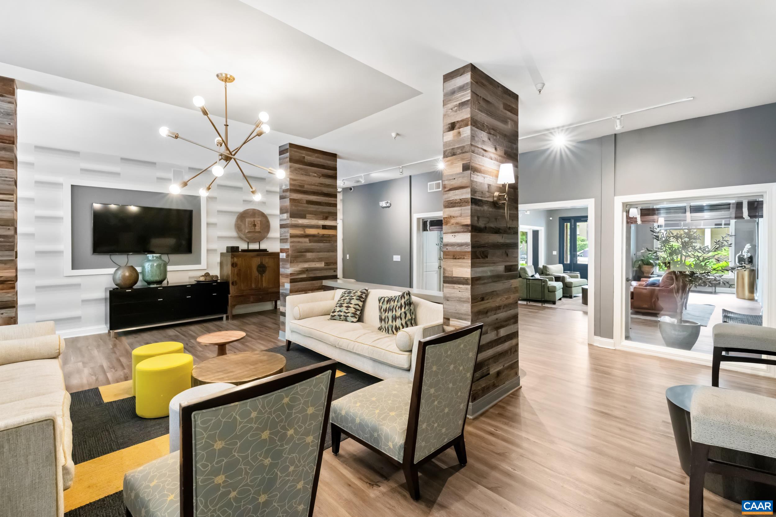 760 Walker Square, Unit 4B Charlottesville, VA 22903 - Photo 25 of 40 a living room with fireplace furniture and a flat screen tv