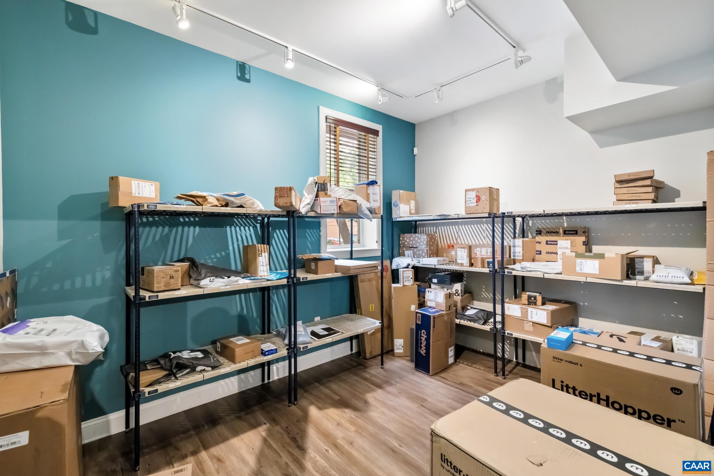 760 Walker Square, Unit 4B Charlottesville, VA 22903 - Photo 37 of 40 a living room with furniture and a wooden floor