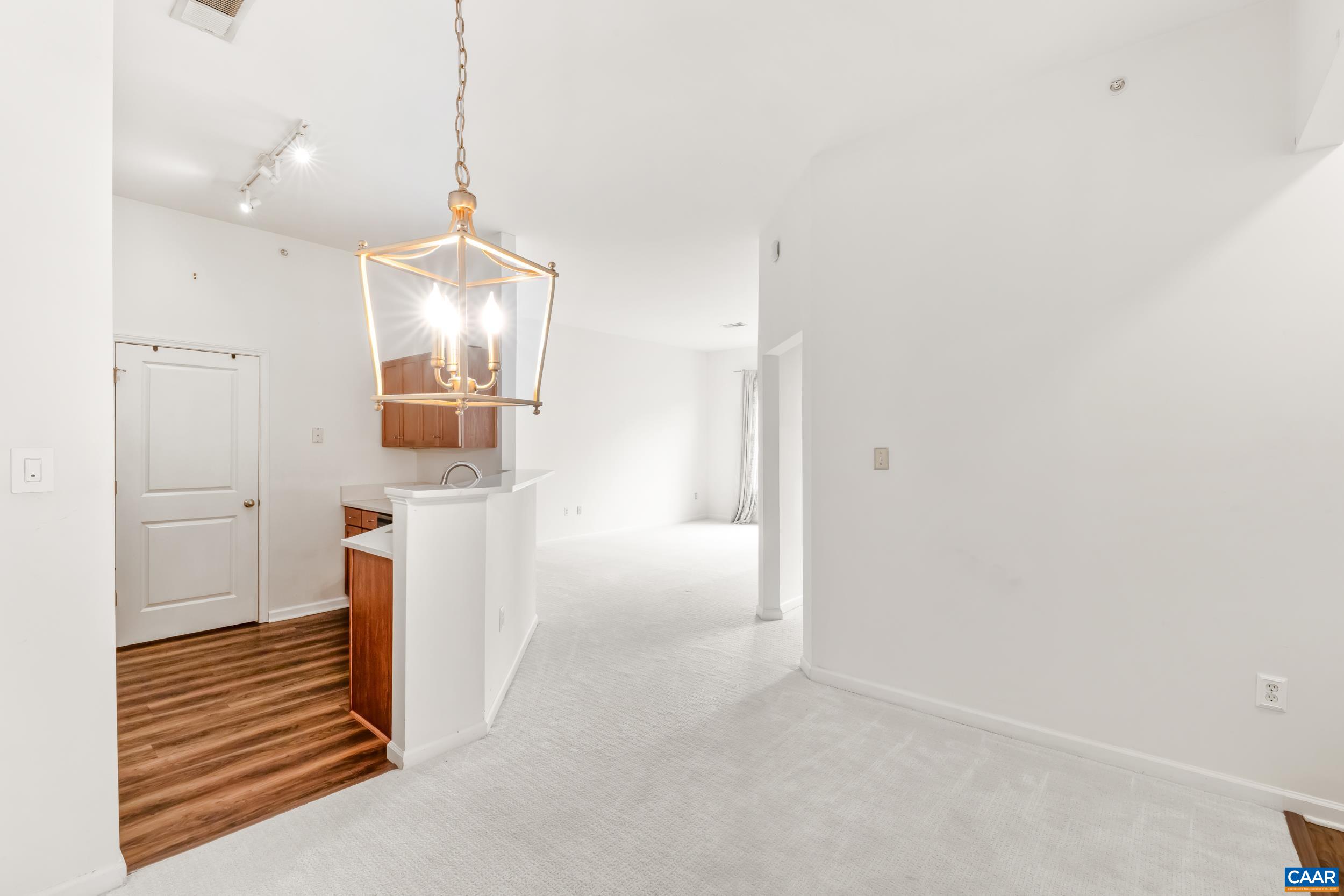 760 Walker Square, Unit 4B Charlottesville, VA 22903 - Photo 9 of 40 a view of a hallway with wooden floor