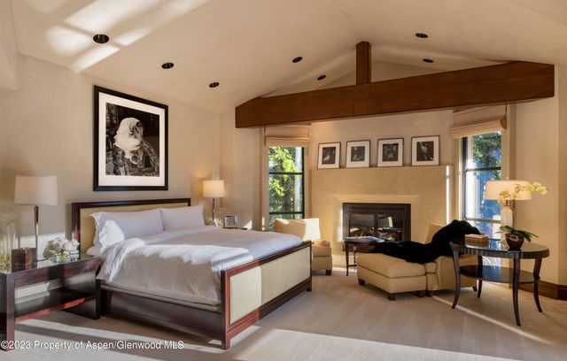 a spacious bedroom with a bed and a couch