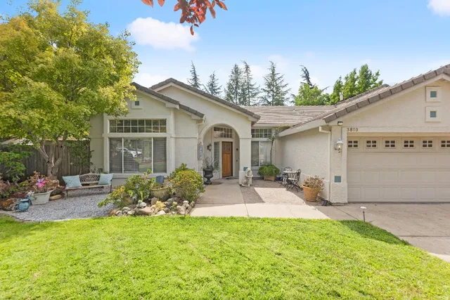 a front view of a house with garden