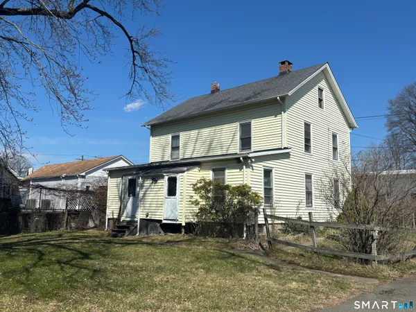 a view of a house with a yard and balcony