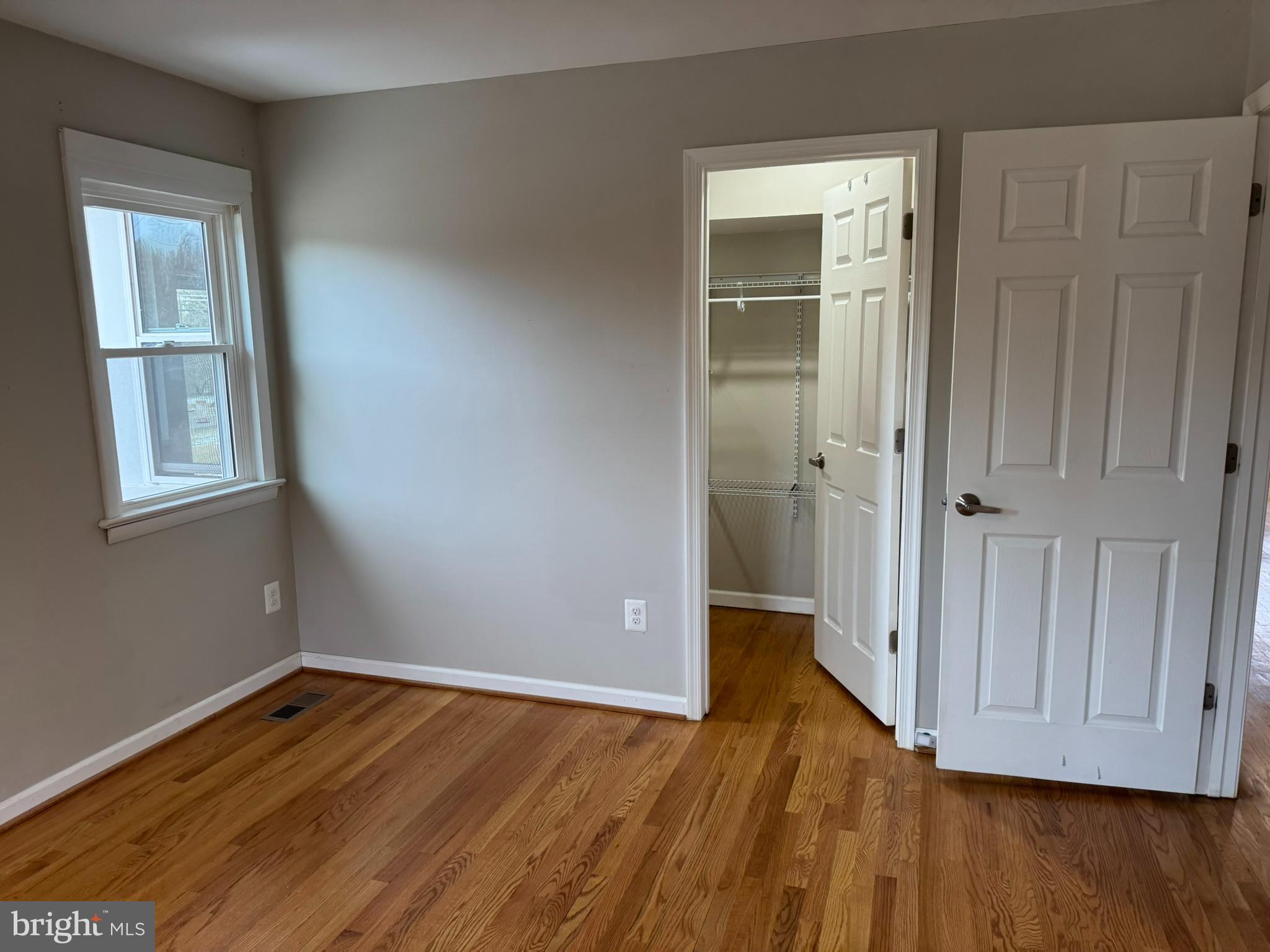 10012 Ellis Road Manassas, VA 20111 - Photo 15 of 71 an empty room with wooden floor and closet area