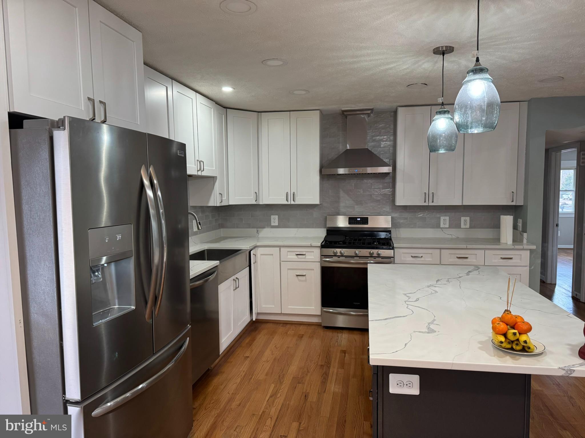 10012 Ellis Road Manassas, VA 20111 - Photo 2 of 71 a kitchen with stainless steel appliances granite countertop a refrigerator and a stove