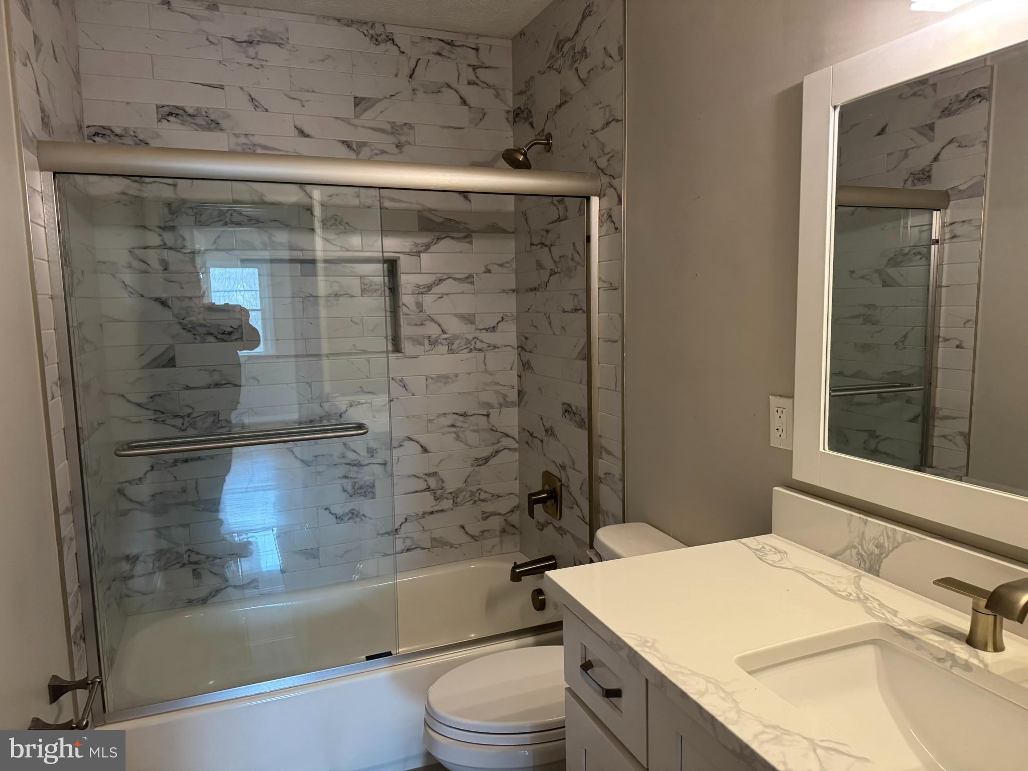 10012 Ellis Road Manassas, VA 20111 - Photo 21 of 71 a bathroom with a sink toilet and shower