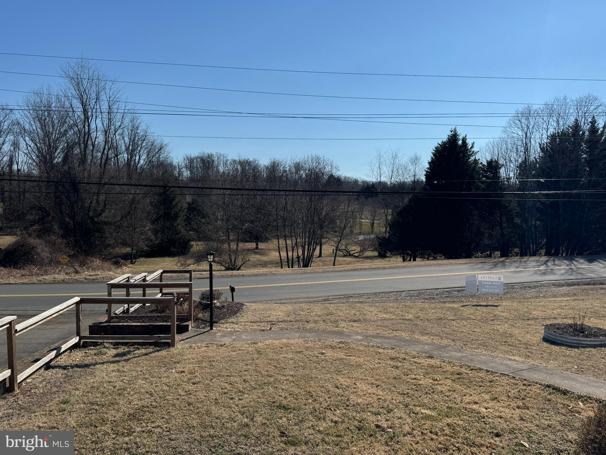 10012 Ellis Road Manassas, VA 20111 - Photo 65 of 71 a view of a lake with a bench in the backyard