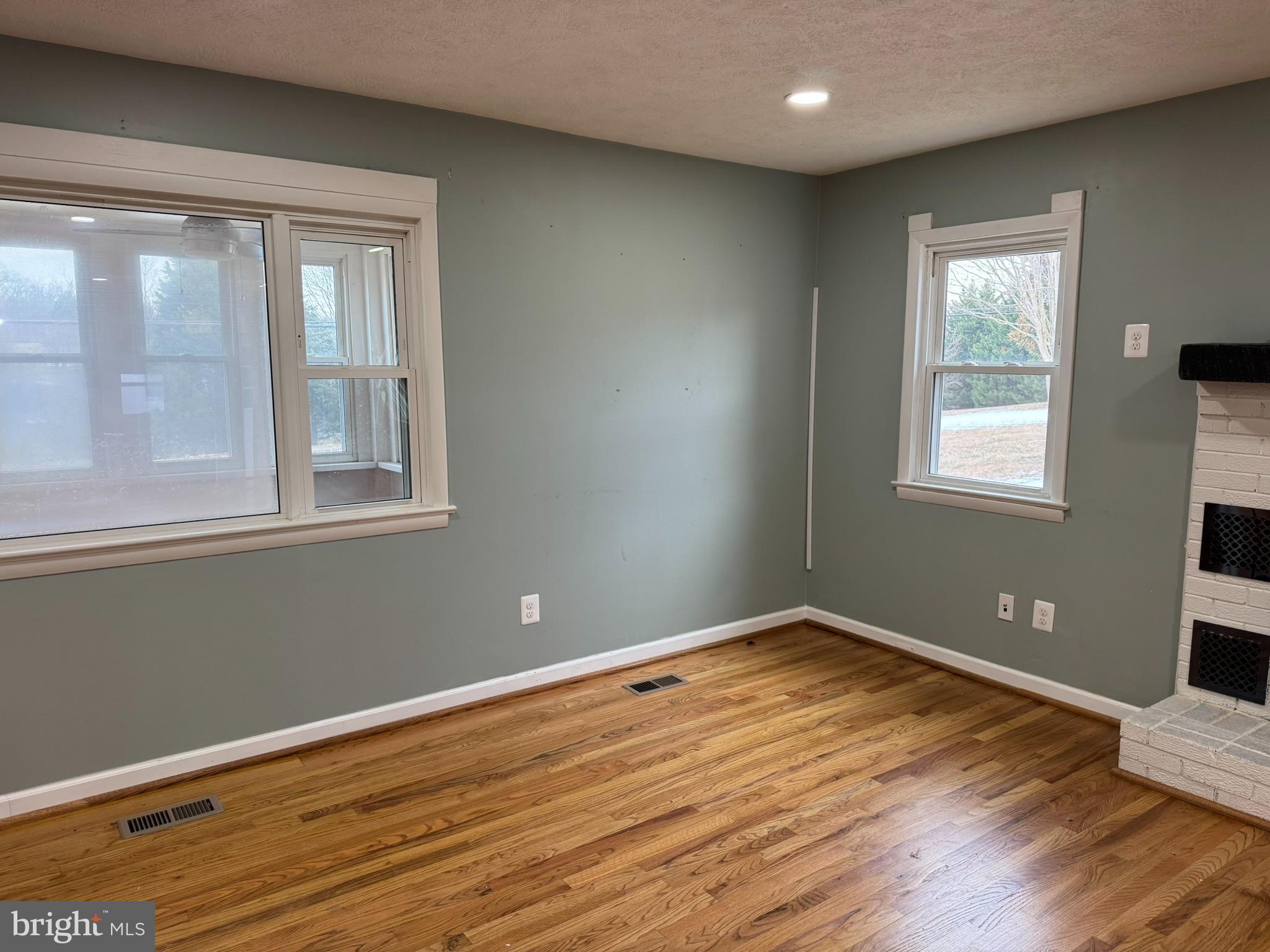 10012 Ellis Road Manassas, VA 20111 - Photo 7 of 71 a view of empty room with wooden floor and fan
