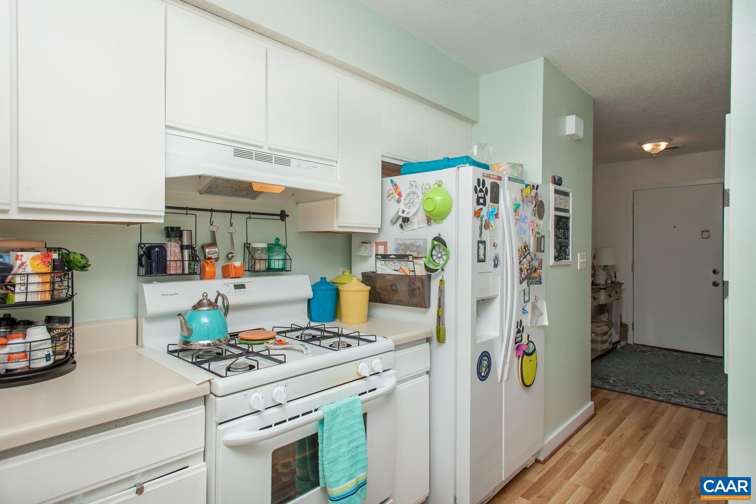 562 Millstone Court Charlottesville, VA 22901 - Photo 19 of 31 a kitchen with refrigerator and cabinets