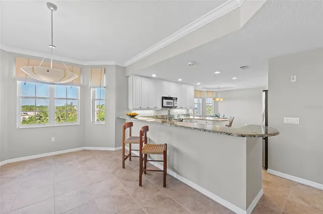 a bedroom with a bed a dresser and a window