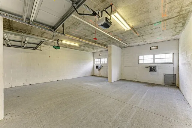 a view of a house with swimming pool and sitting area