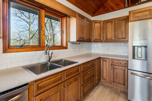 a kitchen with stainless steel appliances granite countertop a stove and a microwave