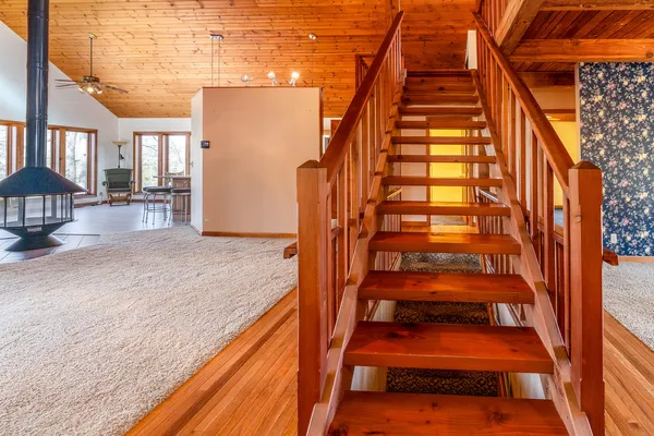 a view of a room with wooden floor