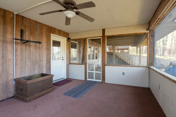 a view of porch with wooden floor