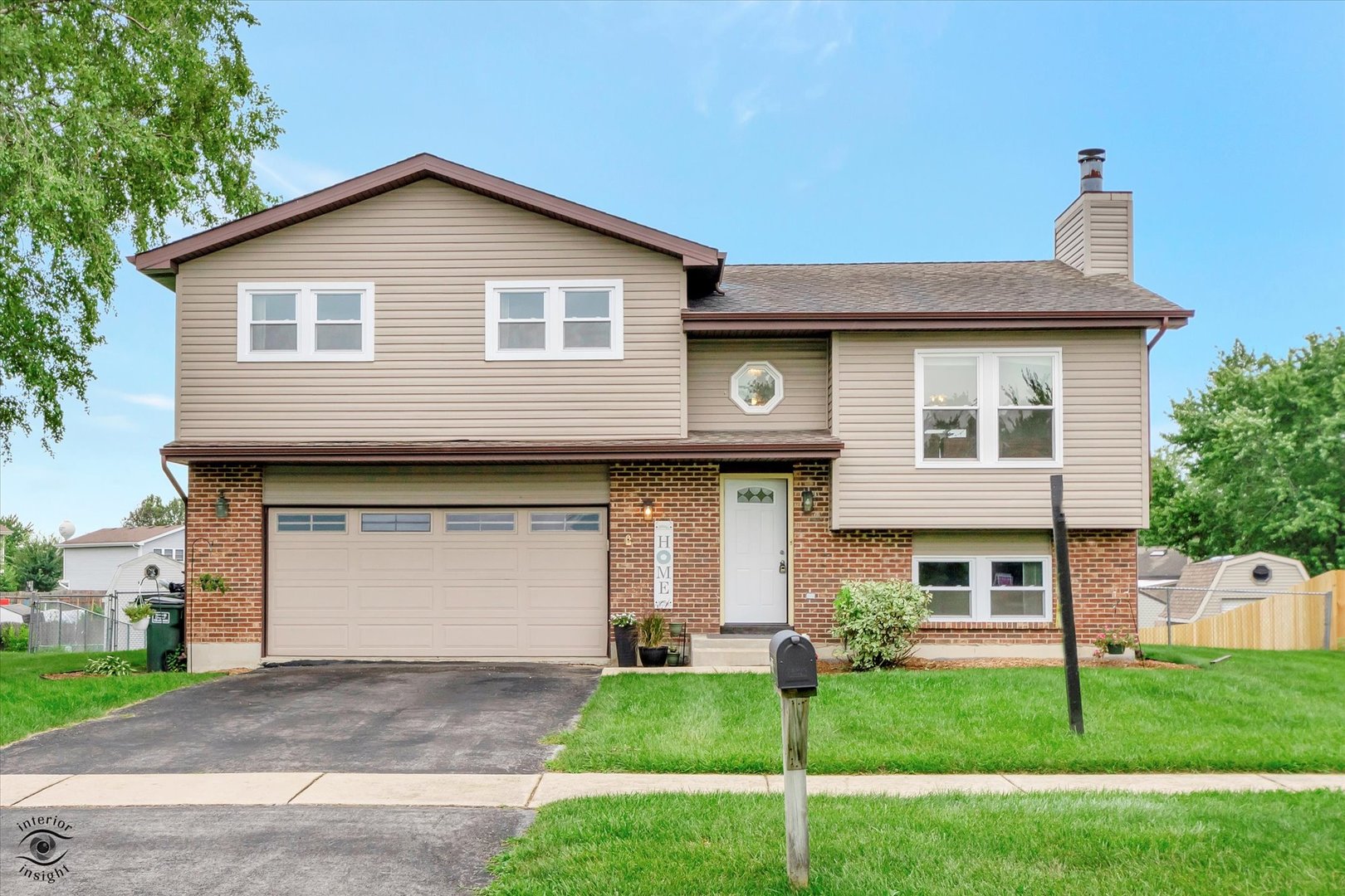 7507 West Tartan Road Frankfort, IL 60423 - Photo 1 of 25 a front view of a house with a garden
