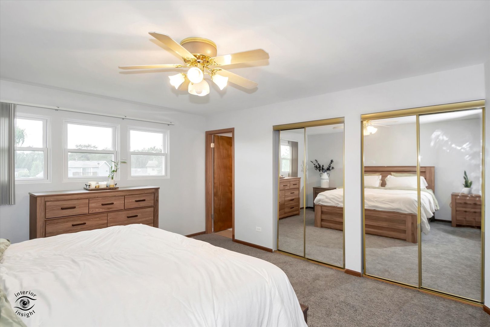 7507 West Tartan Road Frankfort, IL 60423 - Photo 11 of 25 a bedroom with a bed and a chandelier
