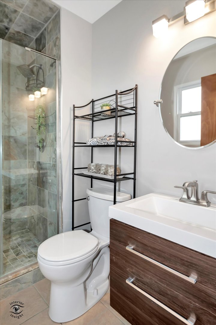 7507 West Tartan Road Frankfort, IL 60423 - Photo 12 of 25 a bathroom with a sink a toilet and shower