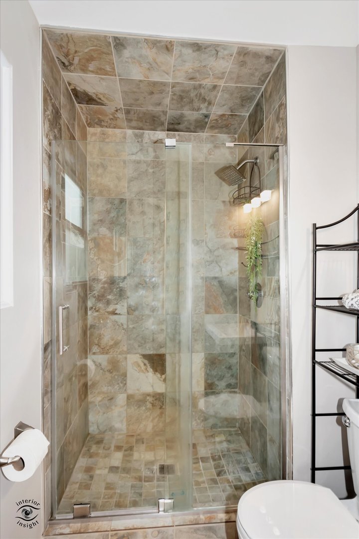 7507 West Tartan Road Frankfort, IL 60423 - Photo 13 of 25 a bathroom with a shower and toilet