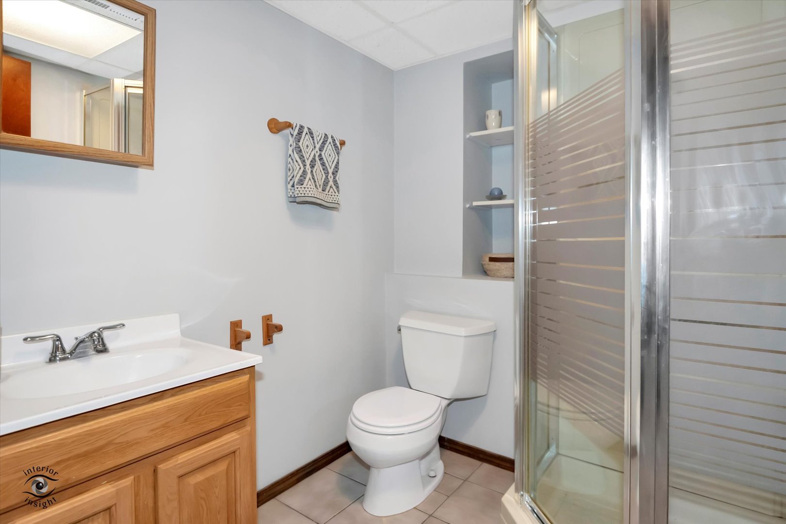 7507 West Tartan Road Frankfort, IL 60423 - Photo 19 of 25 a bathroom with a toilet sink and mirror