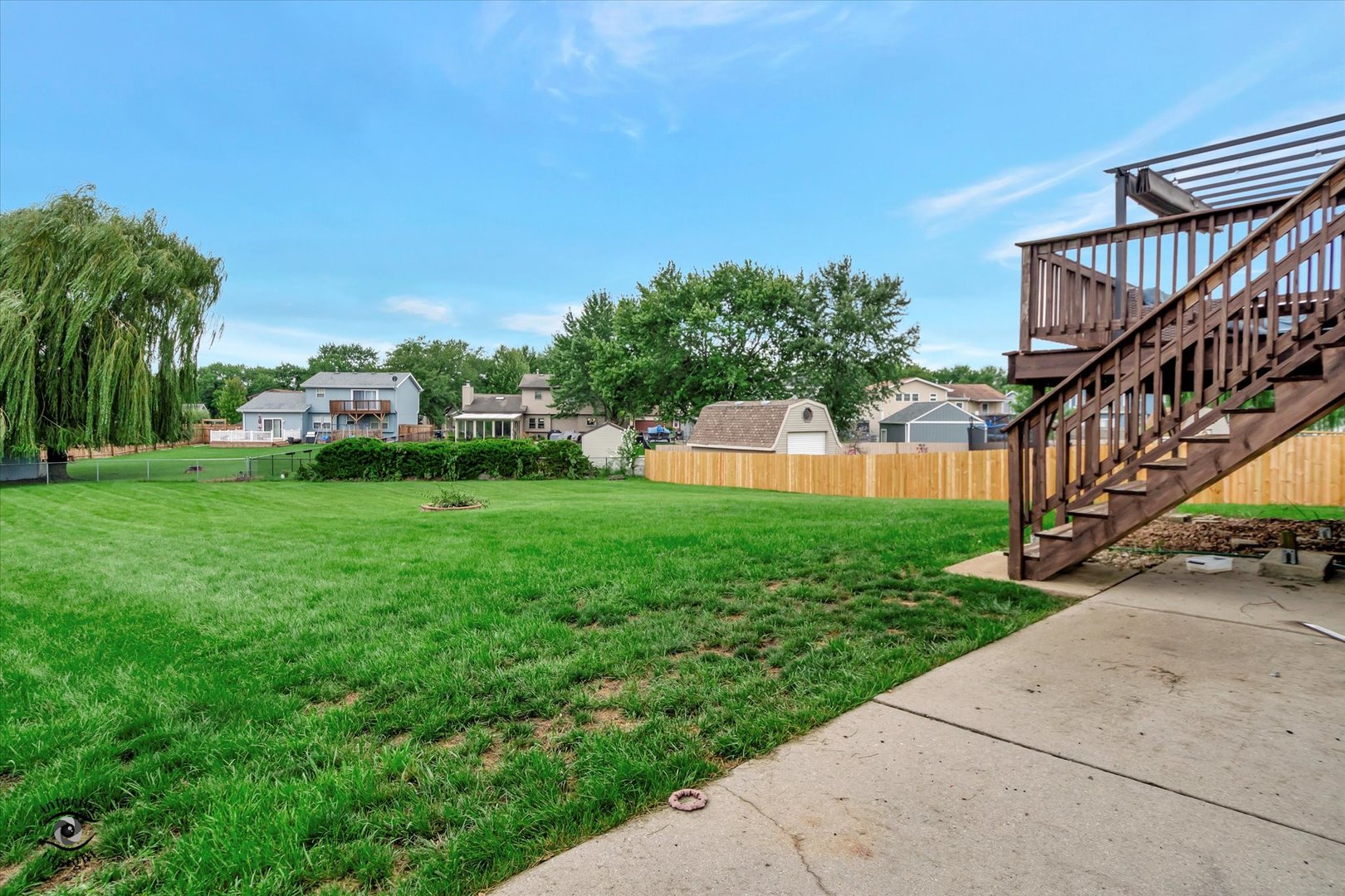 7507 West Tartan Road Frankfort, IL 60423 - Photo 22 of 25 a view of a house with a yard and a patio