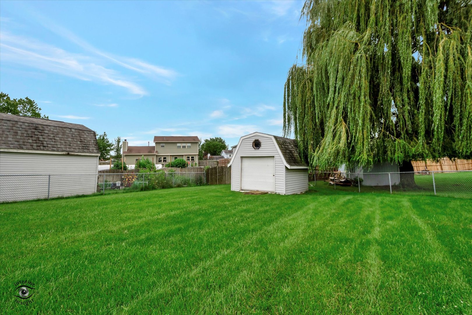 7507 West Tartan Road Frankfort, IL 60423 - Photo 23 of 25 a view of a garden with a building in the background