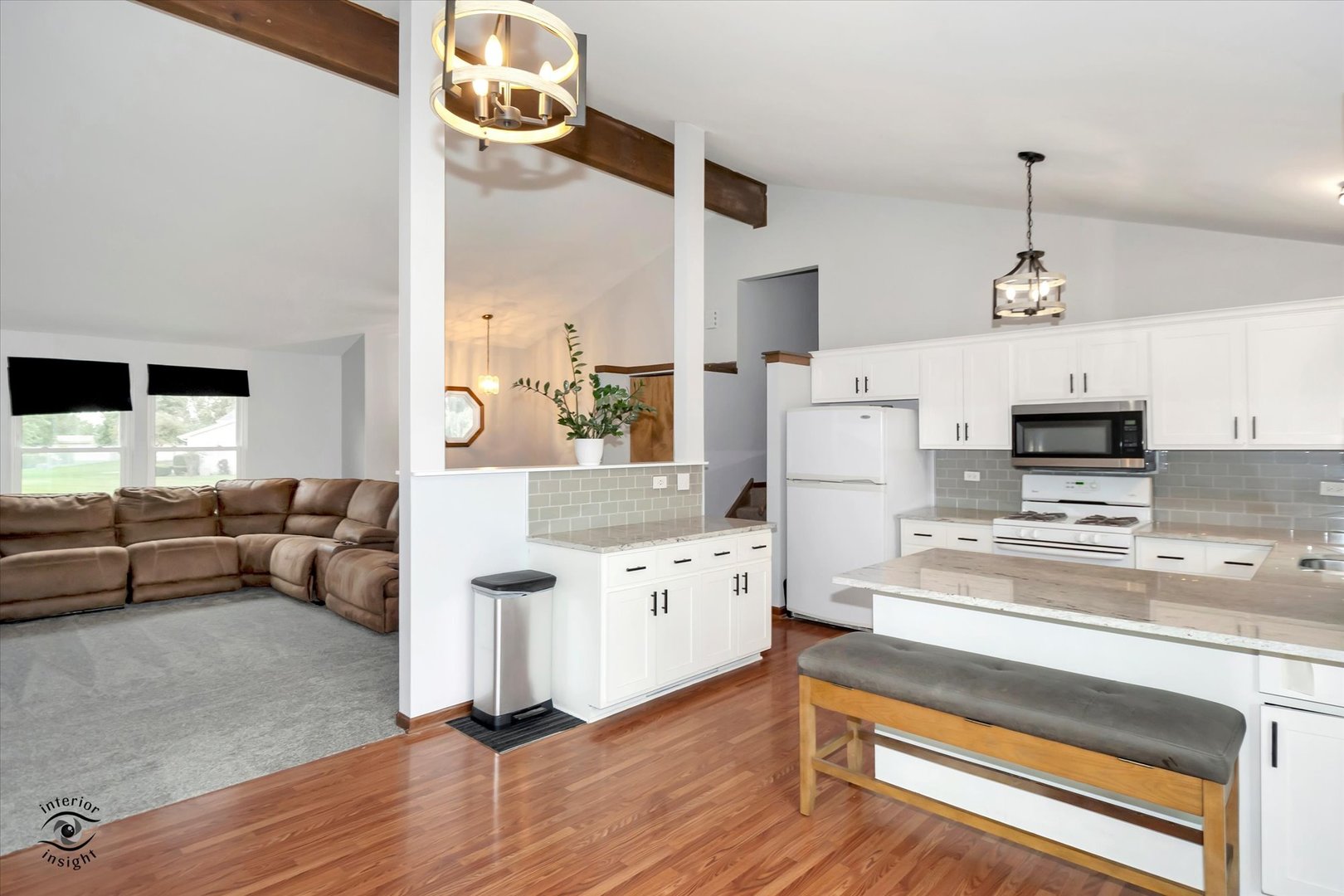 7507 West Tartan Road Frankfort, IL 60423 - Photo 6 of 25 a living room with furniture and a chandelier