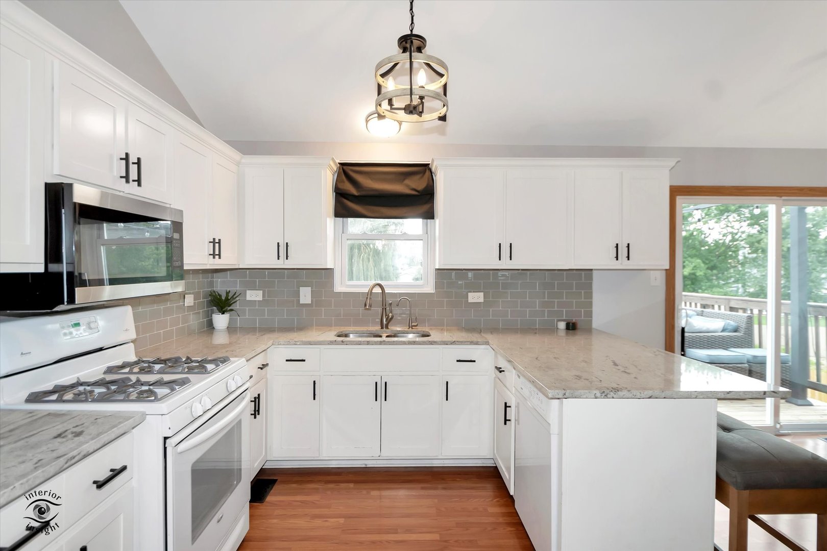 7507 West Tartan Road Frankfort, IL 60423 - Photo 8 of 25 a kitchen with a sink stove and cabinets