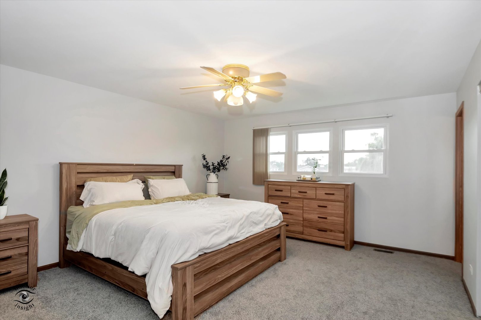7507 West Tartan Road Frankfort, IL 60423 - Photo 10 of 25 a bedroom with a bed and a chandelier