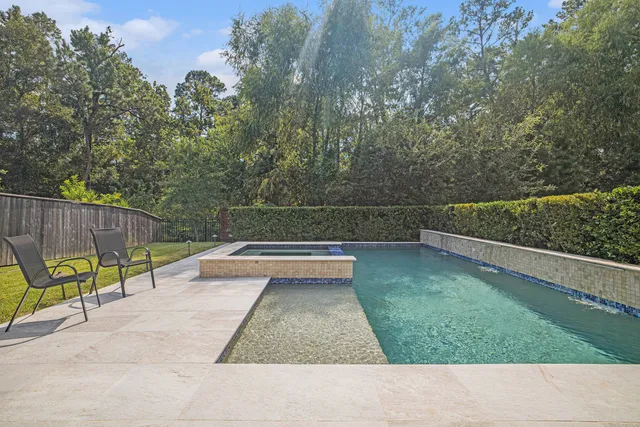 a view of swimming pool with seating space