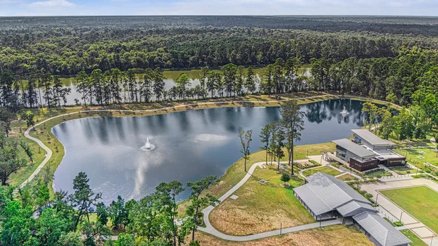 an aerial view of a house with a lake view