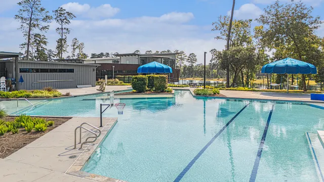 a view of a swimming pool with a patio