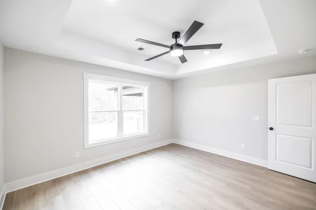 a bathroom with a double vanity sink toilet and mirror