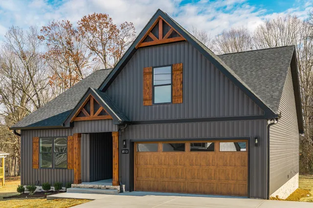 a front view of a house with garage