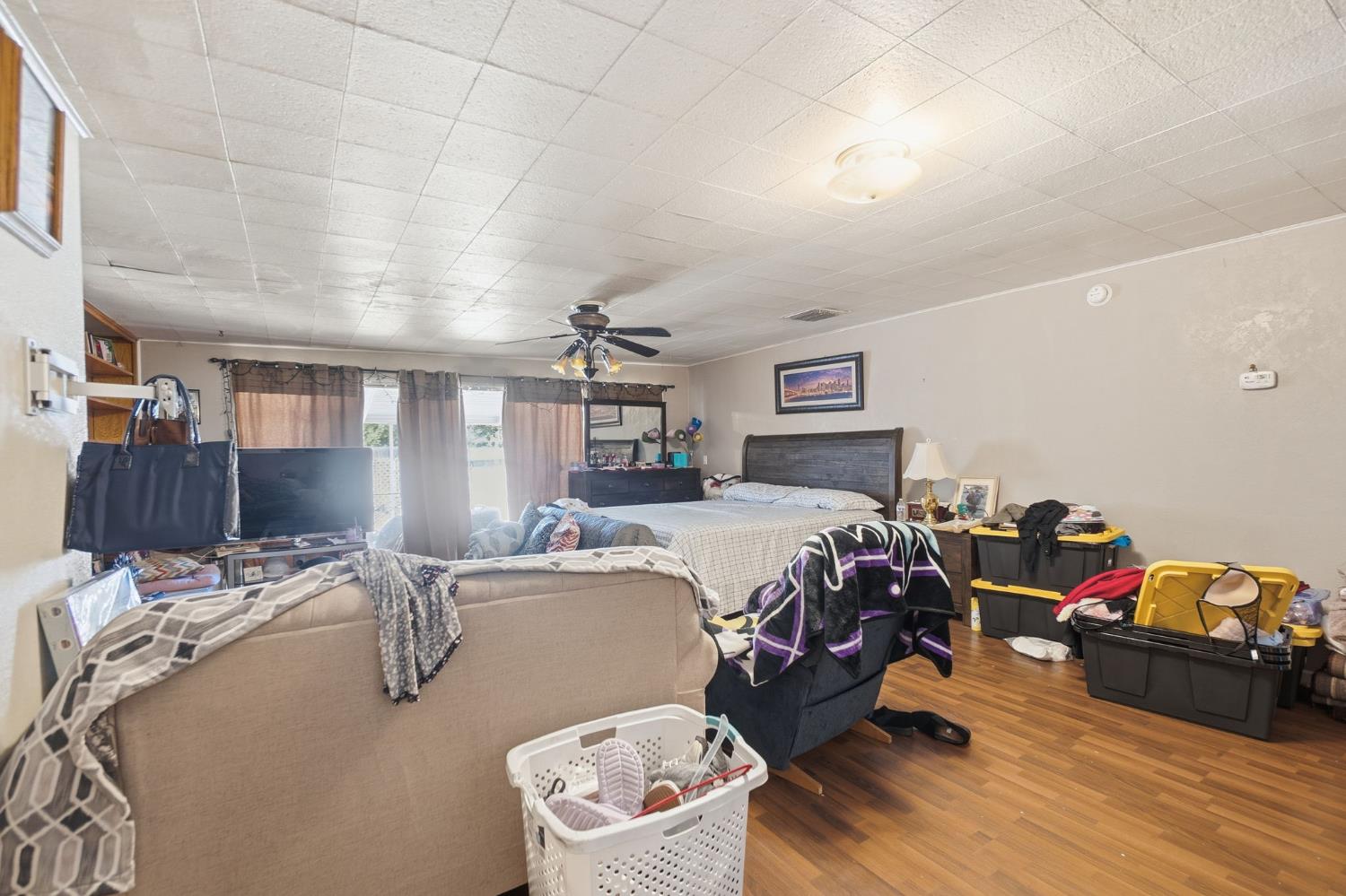 1705 Stetson Avenue Modesto, CA 95350 - Photo 19 of 32 a bedroom with a bed and wooden floor