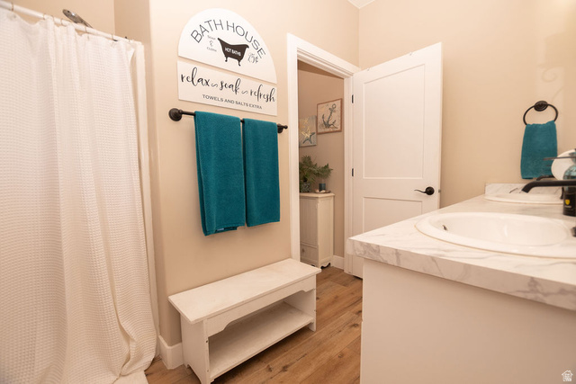 745 East 885 North Beaver, UT 84713 - Photo 29 of 50 Full bathroom with a shower with shower curtain, vanity, and light wood finished floors