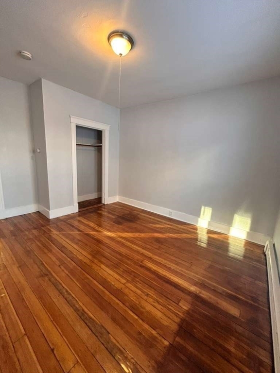 99 Cross Street Southbridge, MA 01550 - Photo 16 of 20 a view of empty room with wooden floor