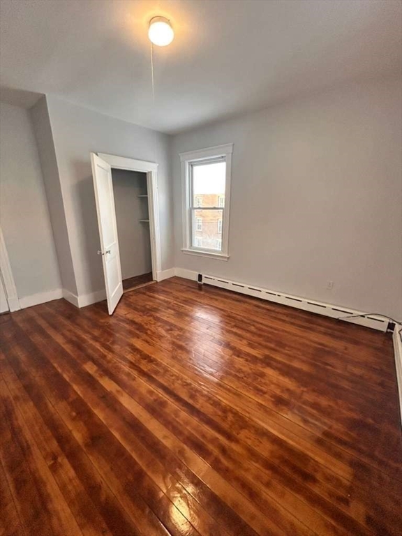 99 Cross Street Southbridge, MA 01550 - Photo 17 of 20 a view of empty room with wooden floor and fan