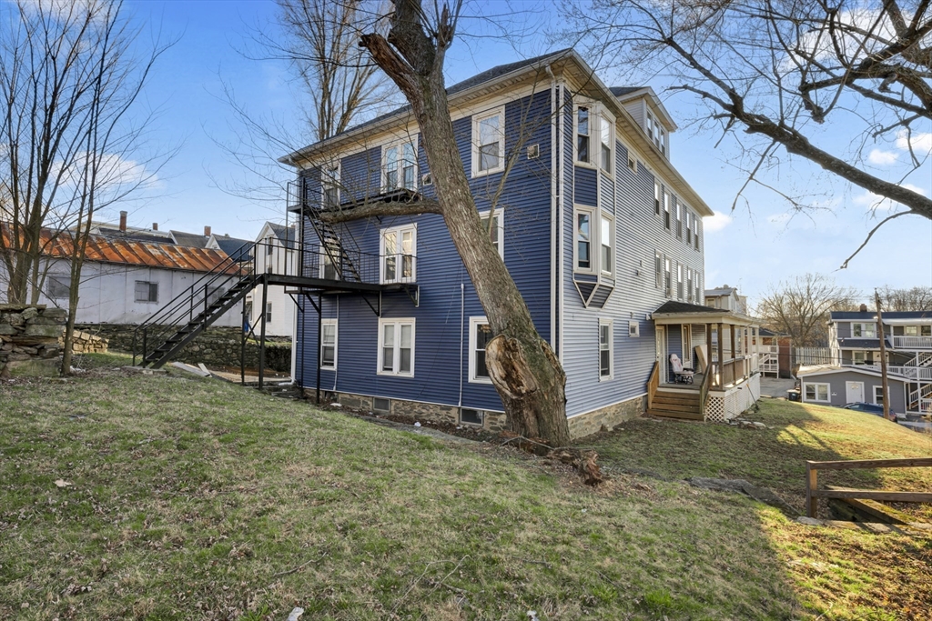 99 Cross Street Southbridge, MA 01550 - Photo 5 of 20 a view of a big house with a yard