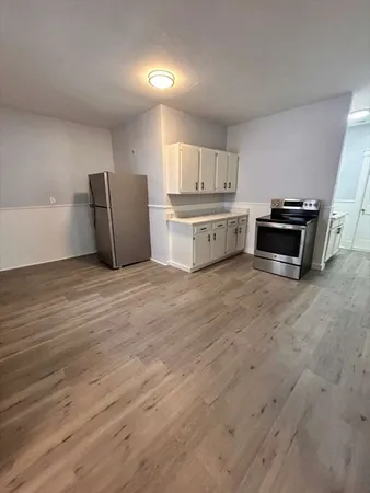 a kitchen with stainless steel appliances a stove and a refrigerator