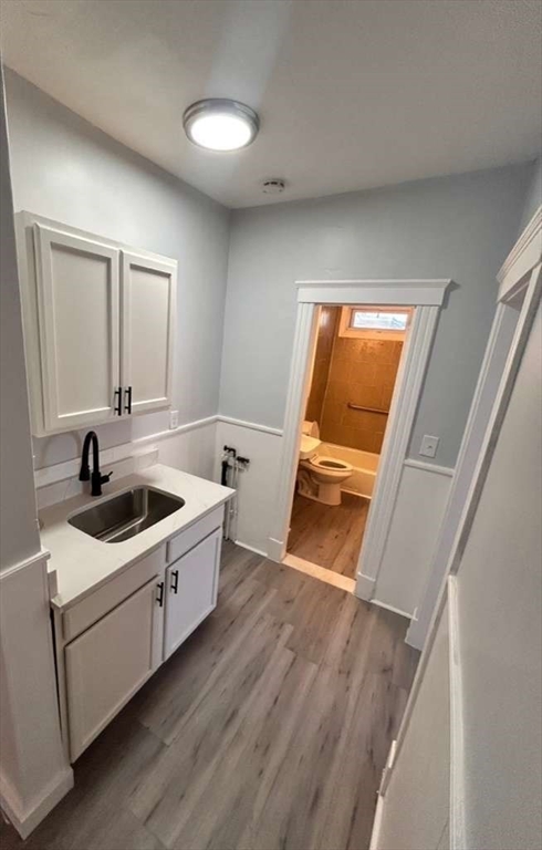 99 Cross Street Southbridge, MA 01550 - Photo 9 of 20 a kitchen with a sink and a stove top oven