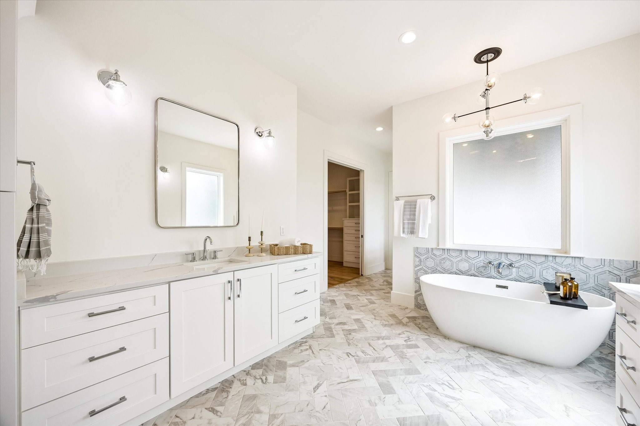 1729 Chippendale Road Houston, TX 77018 - Photo 26 of 45 The primary bathroom is elevated by quartz countertops, adding a timeless and sophisticated touch to the space.