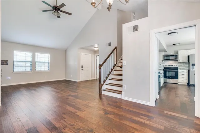 wooden floor in an empty room with a window and wooden floor