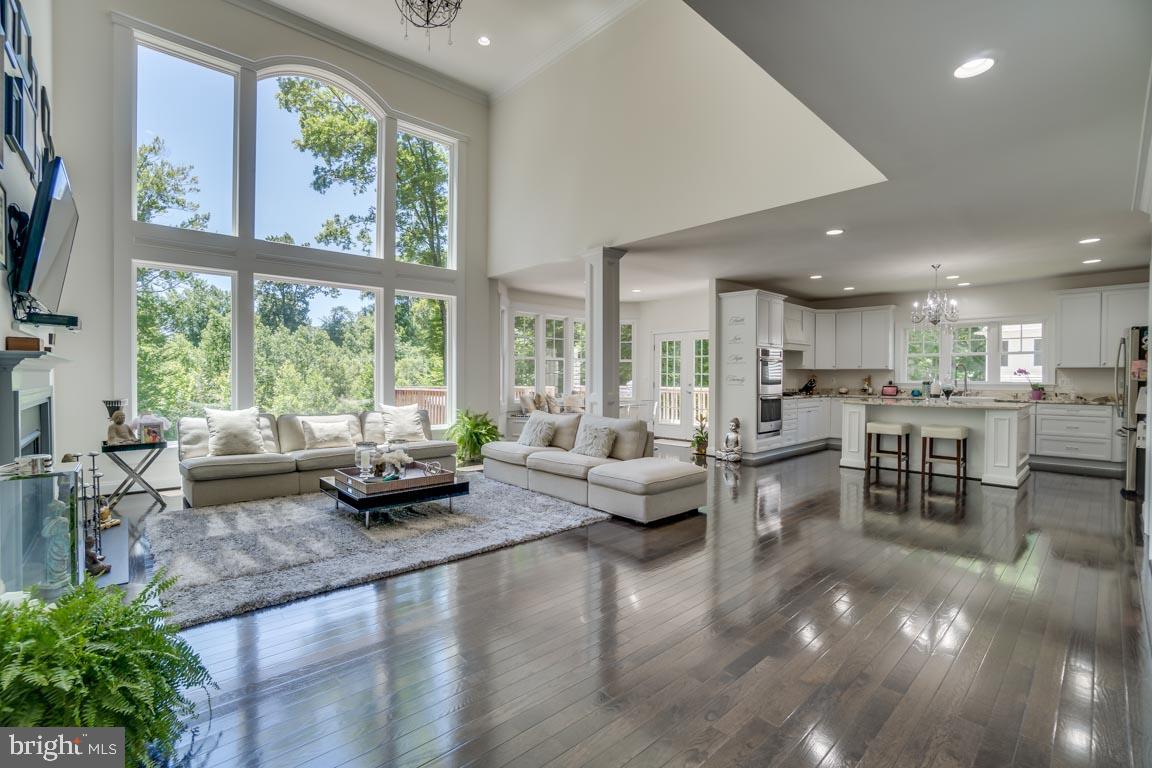 8585 Sinclair Mill Road Manassas, VA 20112 - Photo 1 of 38 Family room with soaring ceilings and windows