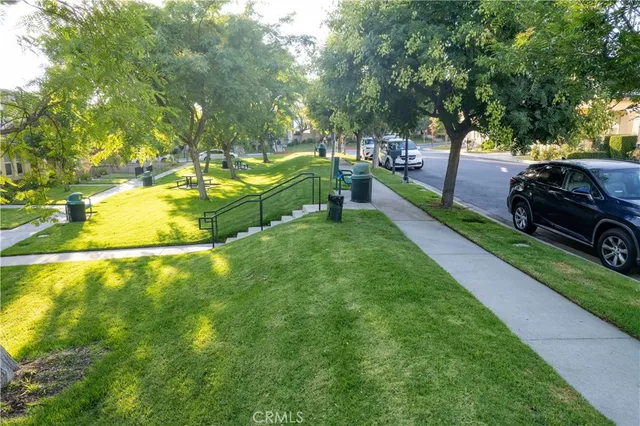 a view of a backyard with swimming pool