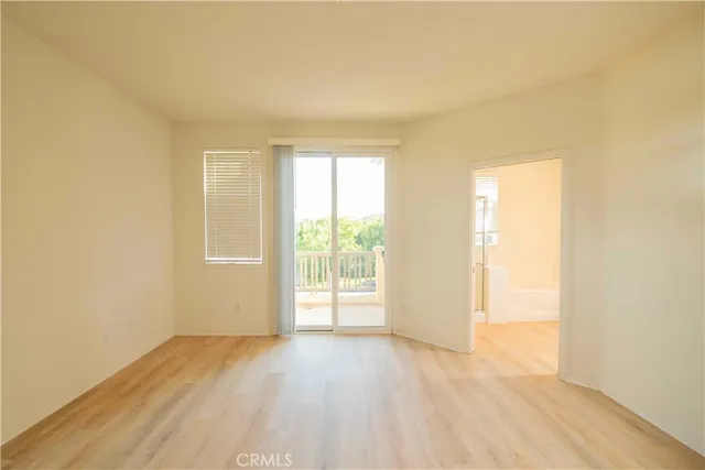 a bathroom with a tub a sink and mirror
