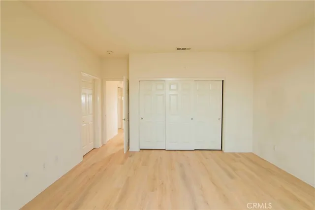 a bathroom with a double vanity sink mirror and a bathtub