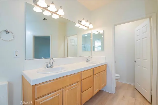 a bathroom with a sink a mirror and a bathtub