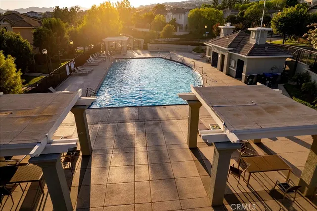 a view of a house with wooden fence