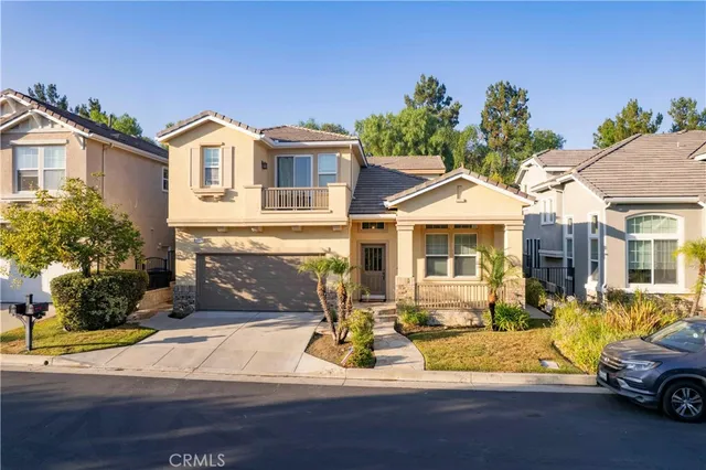 a view of a car parked in front of a white house