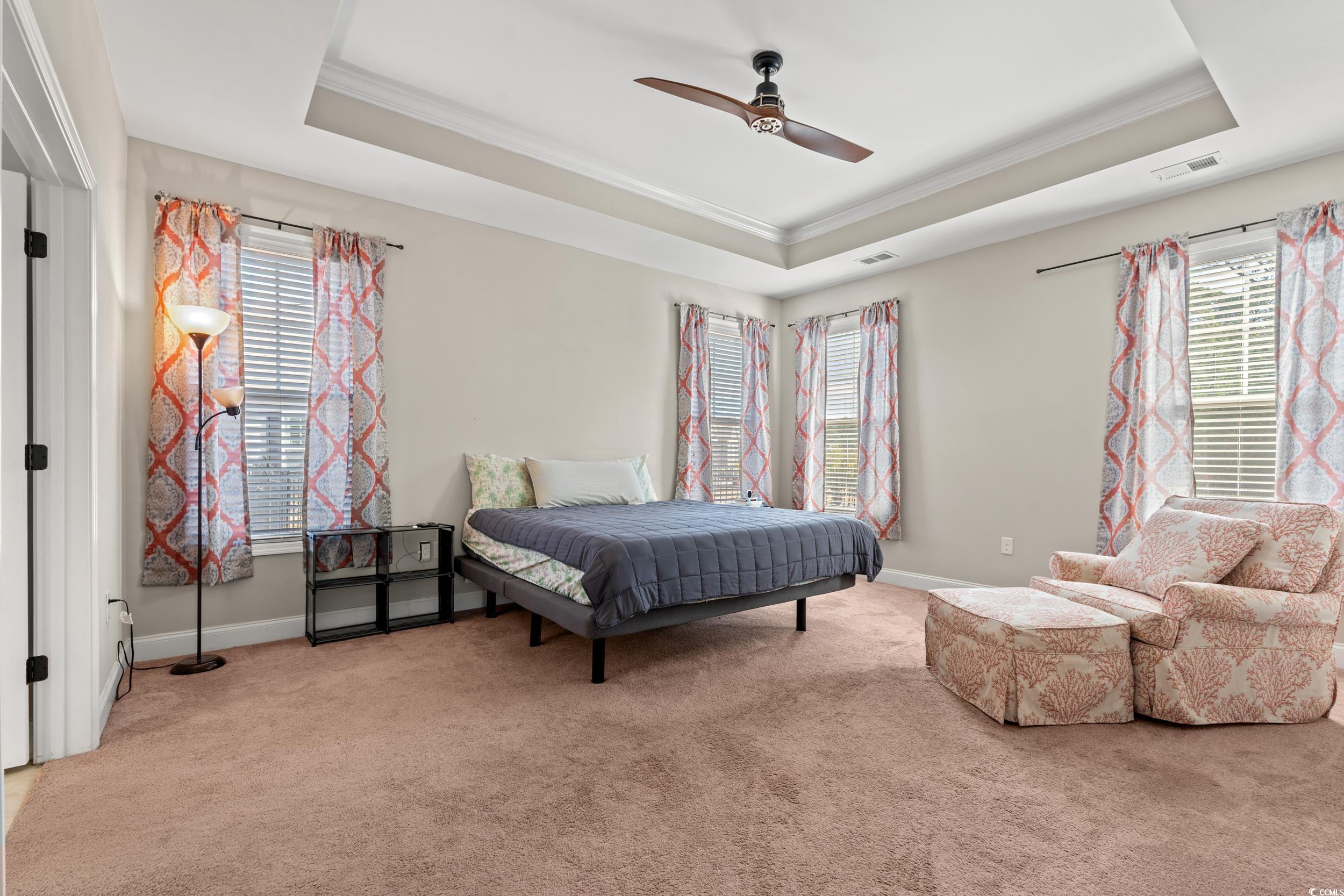 126 Viareggio Road Myrtle Beach, SC 29579 - Photo 15 of 40 Bedroom with a raised ceiling, crown molding, carpet, and ceiling fan