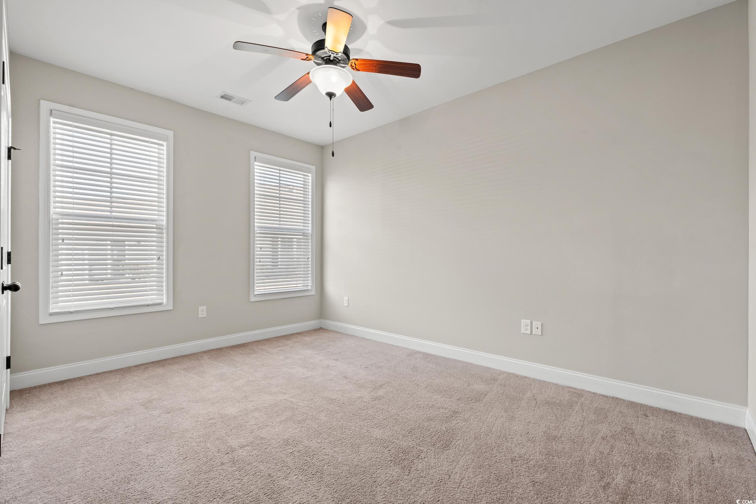 126 Viareggio Road Myrtle Beach, SC 29579 - Photo 22 of 40 Empty room featuring light colored carpet and ceiling fan